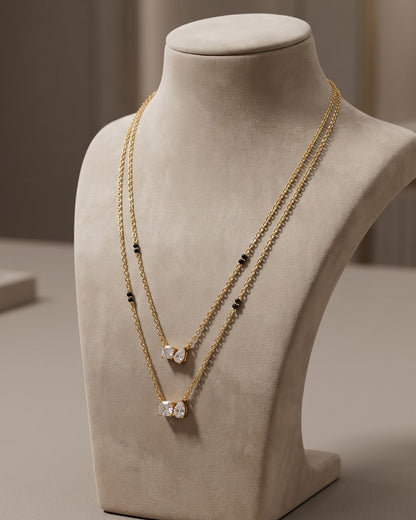 Solvyn Stone Duo Mangalsutra displayed on a jewelry stand showing chain length and beads