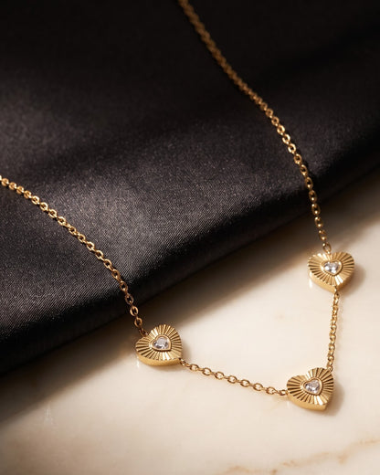 Close-up detail of the Solita Trio Heart Chain Necklace fluted heart stations and CZ stones