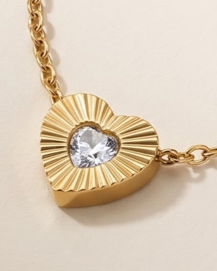 Cinematic close-up of the Solita Trio Heart Chain Necklace heart stations and chain