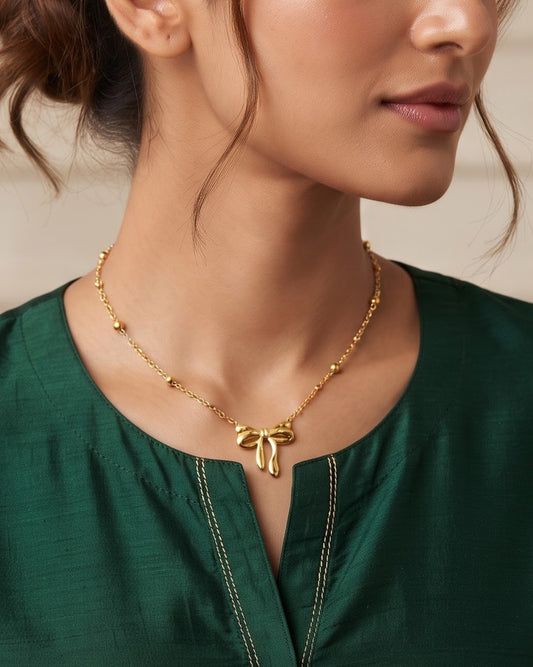 Solenne Bow Pendant Necklace – Worn shot