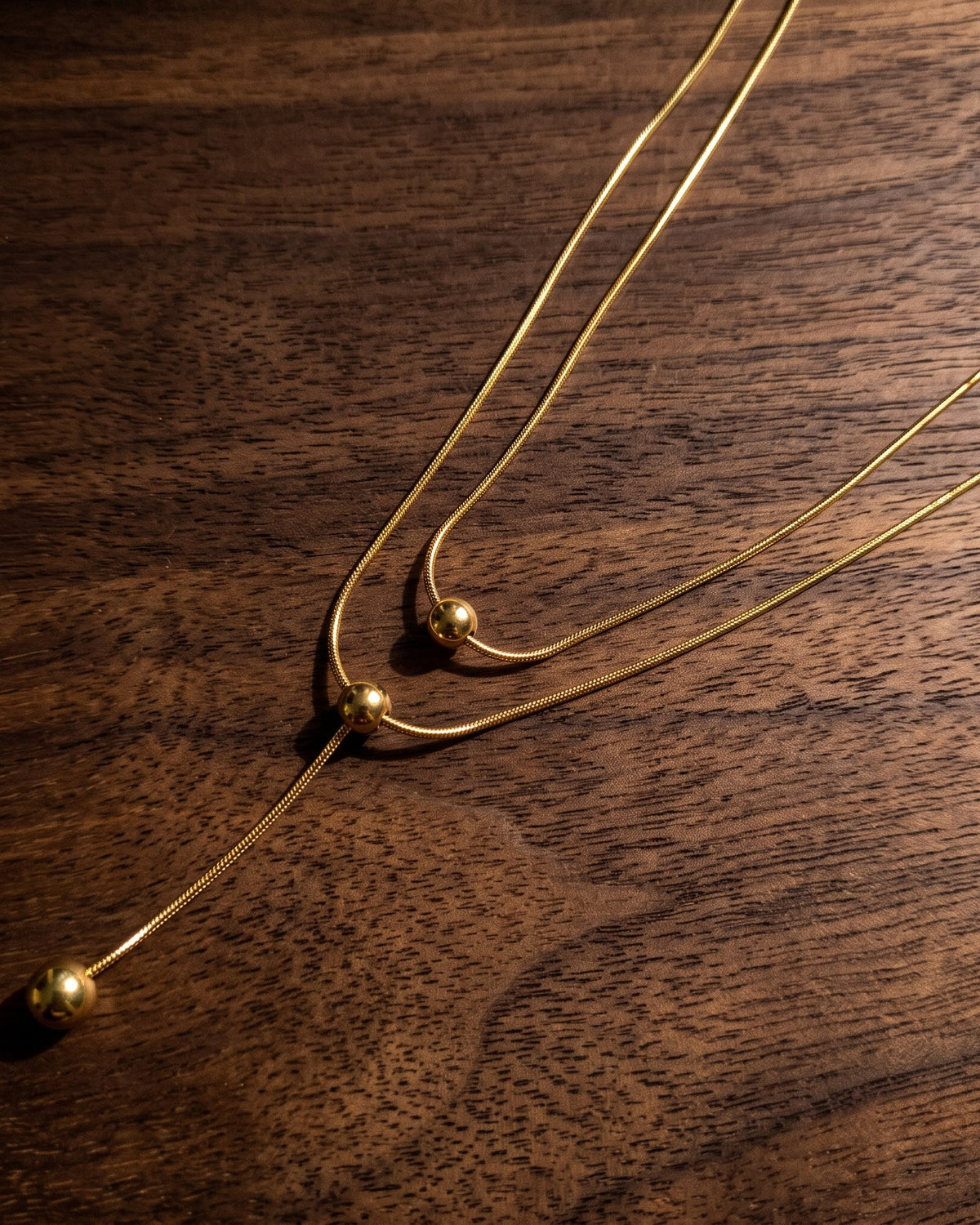 Solquenn Twin Ball Lariat Necklace - Close-up view
