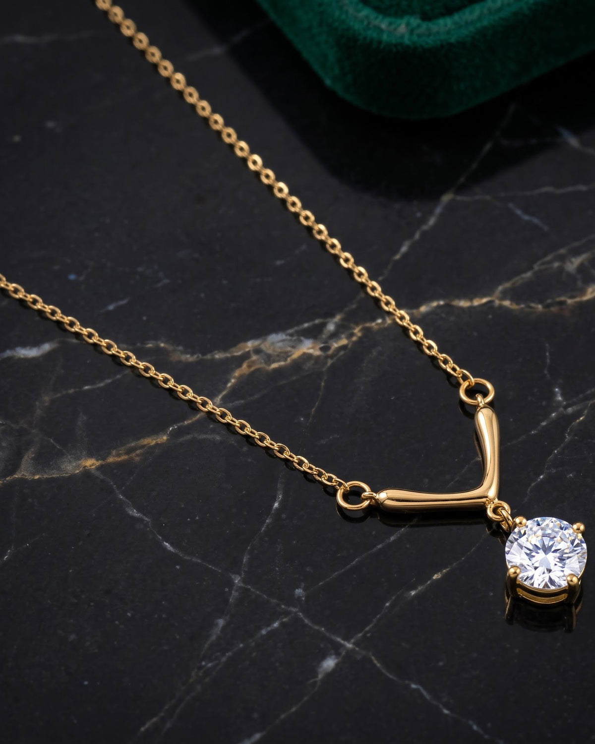 Solquera Chevron Pendant Necklace - gold-tone chevron pendant necklace with a clear cubic zirconia stone
