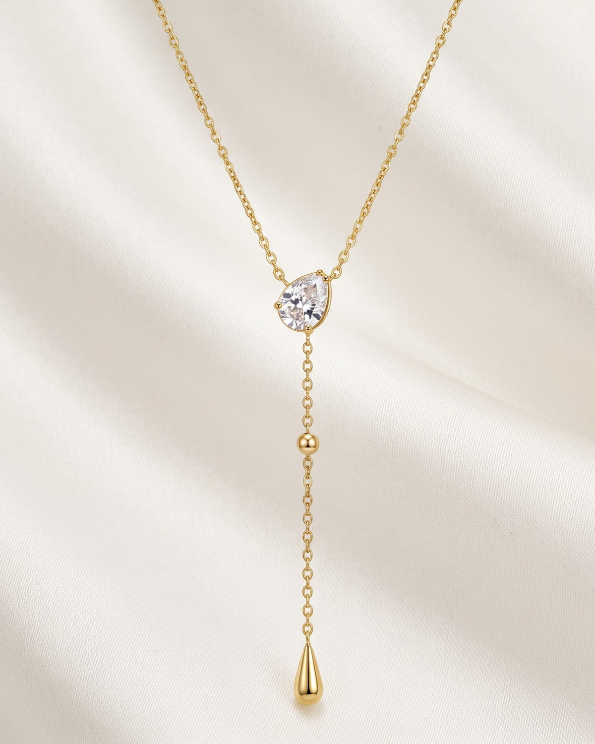 Solmavi Pear Drop Lariat Necklace - gold-tone lariat necklace with a pear-shaped cubic zirconia stone and teardrop drop
