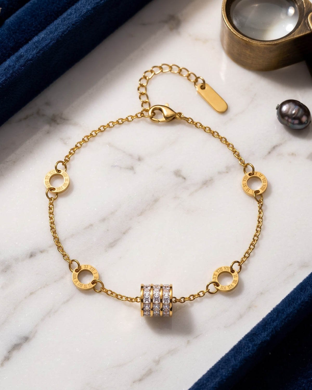Soltiera Roman Disc Chain Bracelet - gold-tone chain bracelet with Roman numeral discs and a cubic zirconia barrel charm