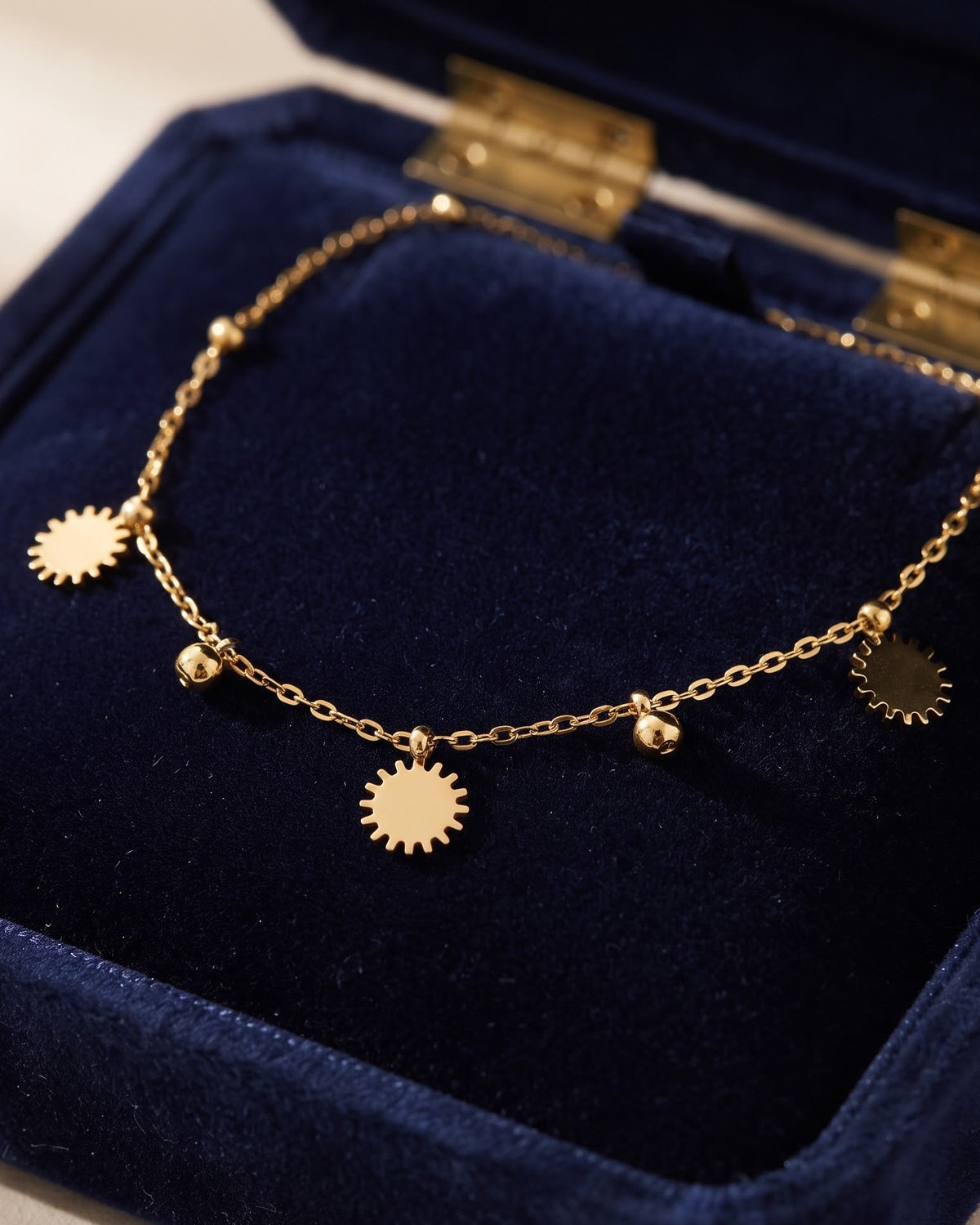 Soltamo Sunburst Charm Anklet - worn view on ankle