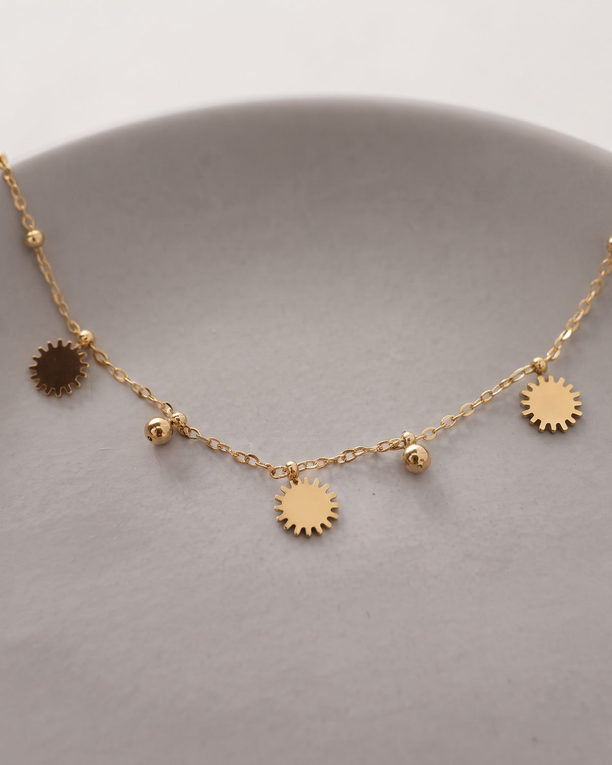 Soltamo Sunburst Charm Anklet - display stand view