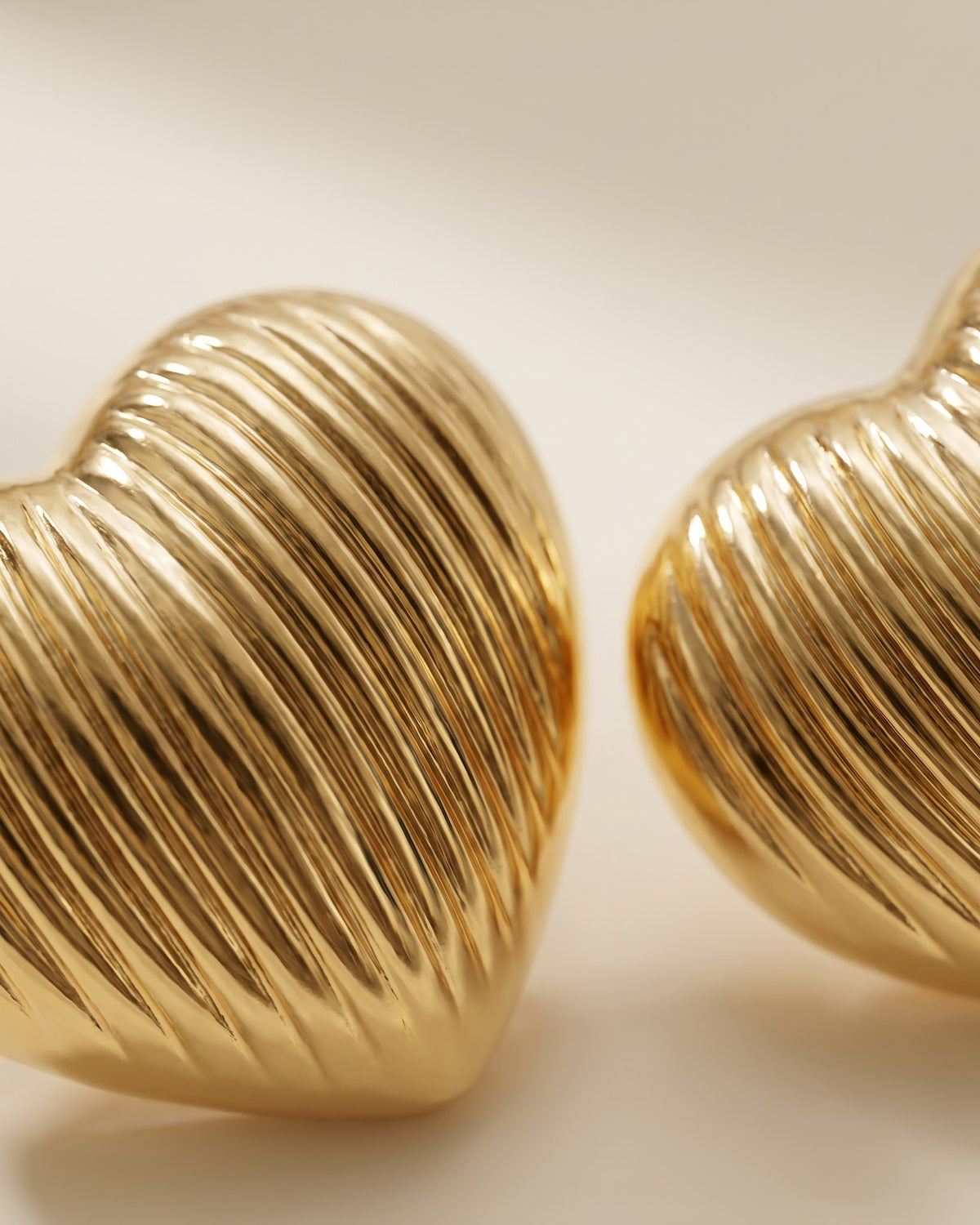Solrovia Ribbed Heart Stud Earrings - Cinematic Shot