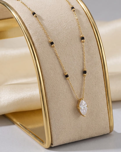 Solvena Marquise Solitaire Mangalsutra displayed on a jewelry stand showing chain length