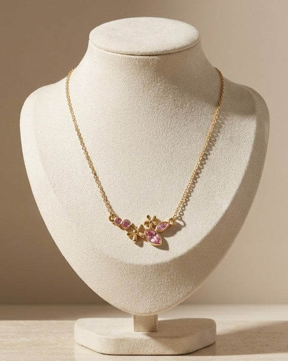 Solteya Pink Blossom Pendant Necklace — on display stand