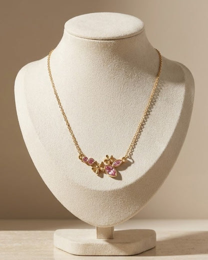 Solteya Pink Blossom Pendant Necklace — on display stand