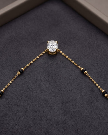 Close-up detail of the Solyne Oval Solitaire Mangalsutra a bezel-set oval cubic zirconia solitaire