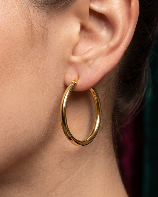 Solniva Tube Hoop Earrings - Worn Shot