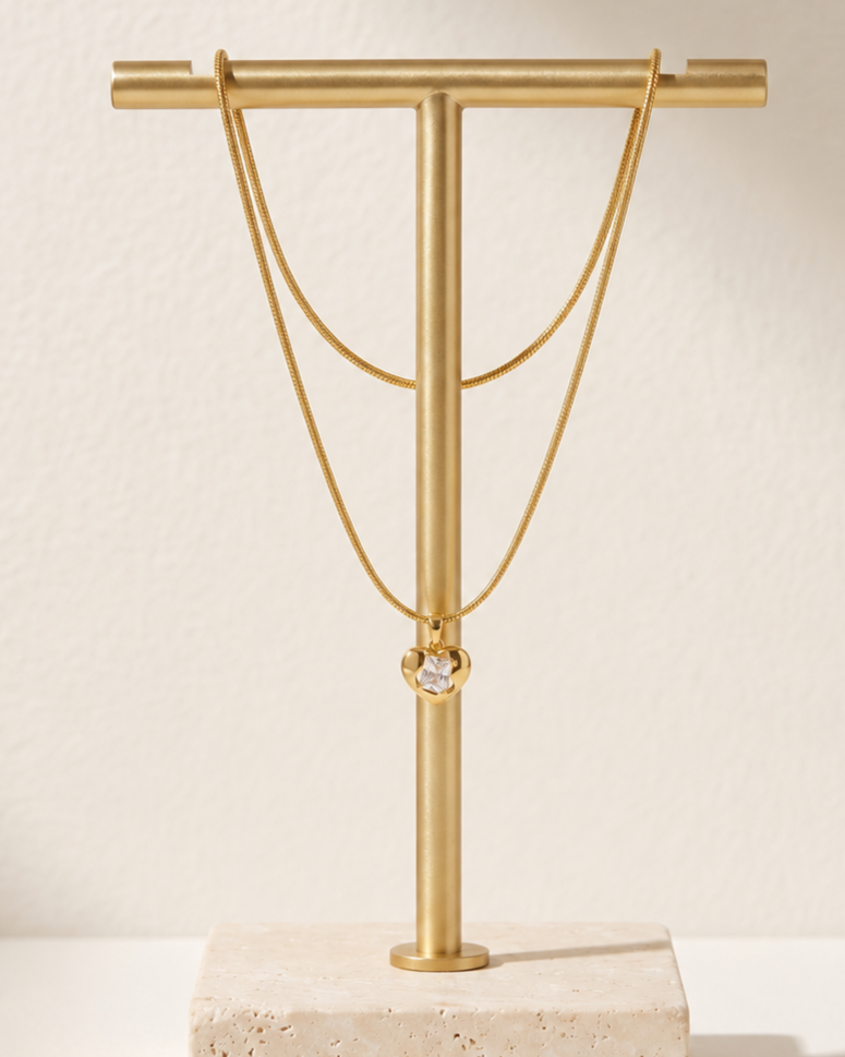 Solira Gem Heart Pendant Necklace displayed on jewelry stand
