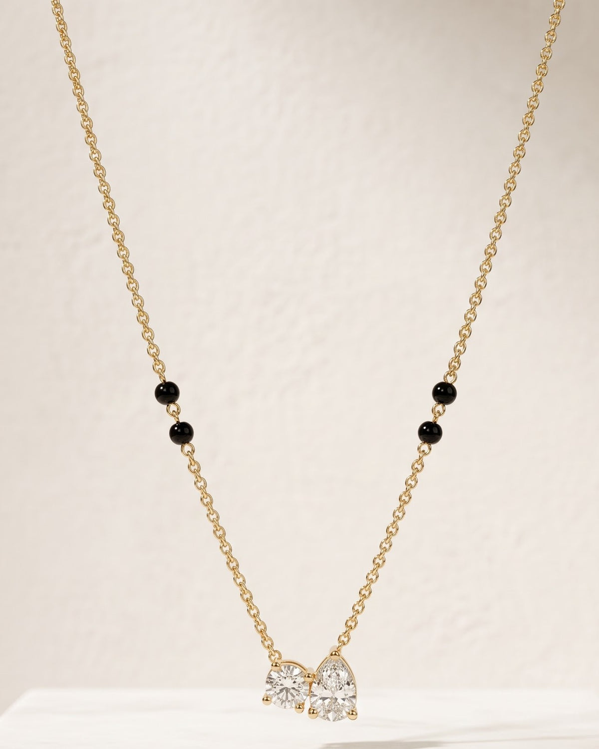 Close-up detail of the Solveya Drop Duo Mangalsutra a pear-cut and round-cut cubic zirconia duo
