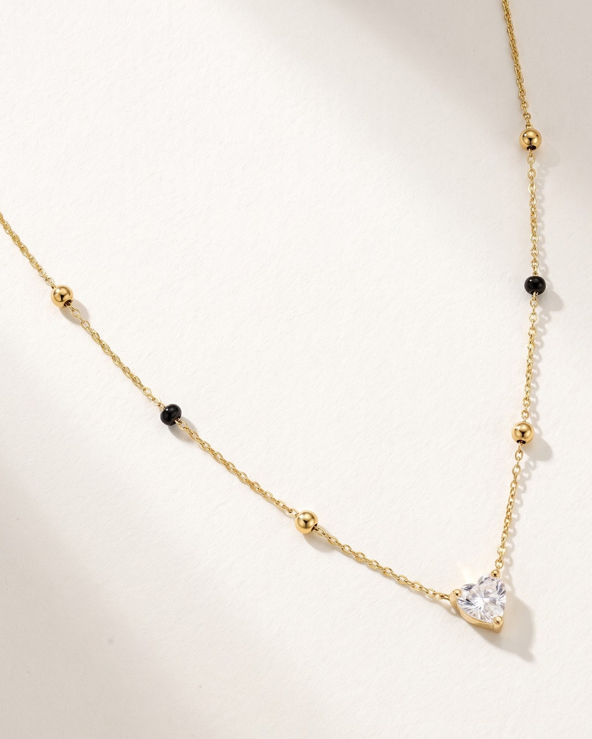 Close-up detail of the Solura Heart Mangalsutra a heart-shaped cubic zirconia pendant
