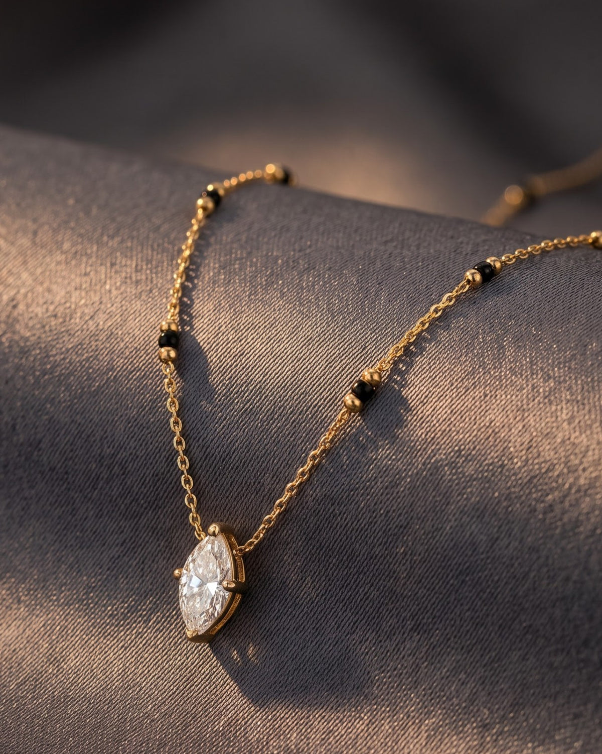 Close-up detail of the Solvena Marquise Solitaire Mangalsutra a marquise-cut cubic zirconia solitaire