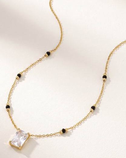 Close-up detail of the Solreya Baguette Solitaire Mangalsutra a bezel-set baguette cubic zirconia solitaire