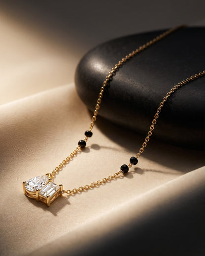 Solyna Teardrop Duo Mangalsutra displayed on a jewelry stand showing chain length