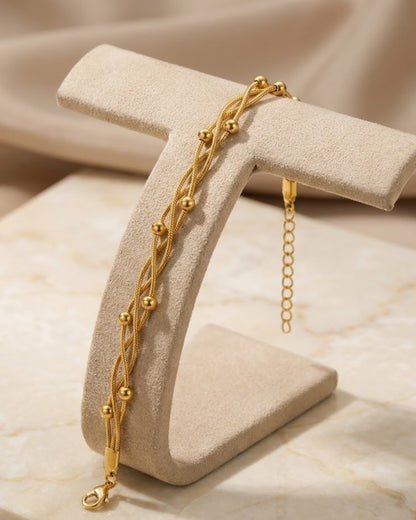 Solvora Woven Trio Chain Bracelet — on display stand