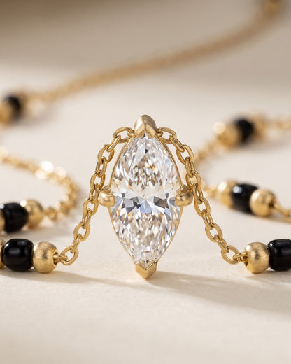 Cinematic close-up of the Solvena Marquise Solitaire Mangalsutra chain and a marquise-cut cubic zirconia solitaire