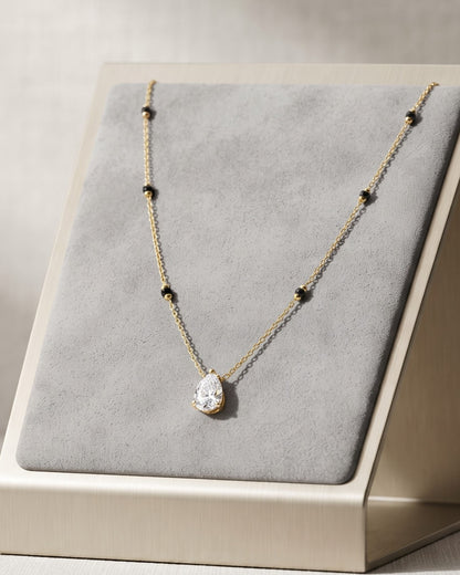 Solveth Drop Solitaire Mangalsutra displayed on a jewelry stand showing chain length