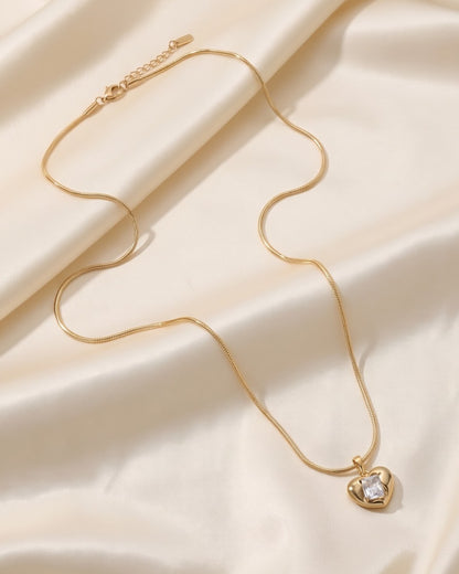 Solira Gem Heart Pendant Necklace - hero shot of gold-tone heart pendant on snake chain