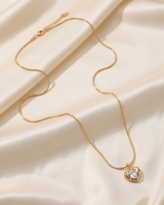 Solira Gem Heart Pendant Necklace - hero shot of gold-tone heart pendant on snake chain