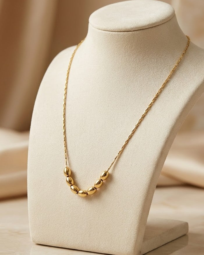 Solyona Rolling Bead Chain Necklace — on display stand