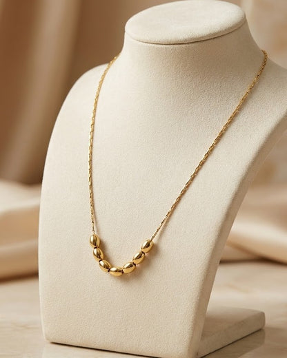Solyona Rolling Bead Chain Necklace — on display stand