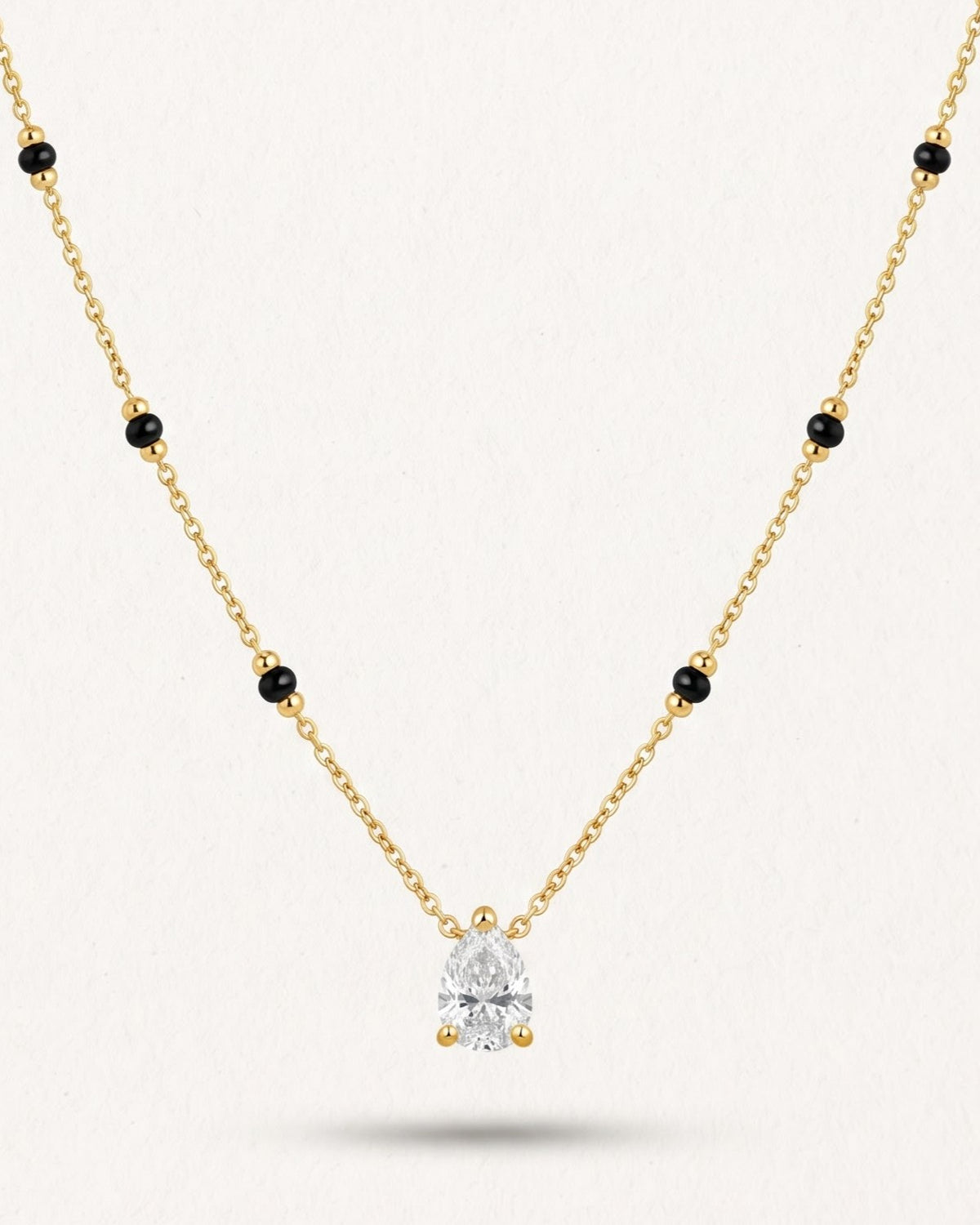 Close-up detail of the Solveth Drop Solitaire Mangalsutra a pear-cut cubic zirconia solitaire