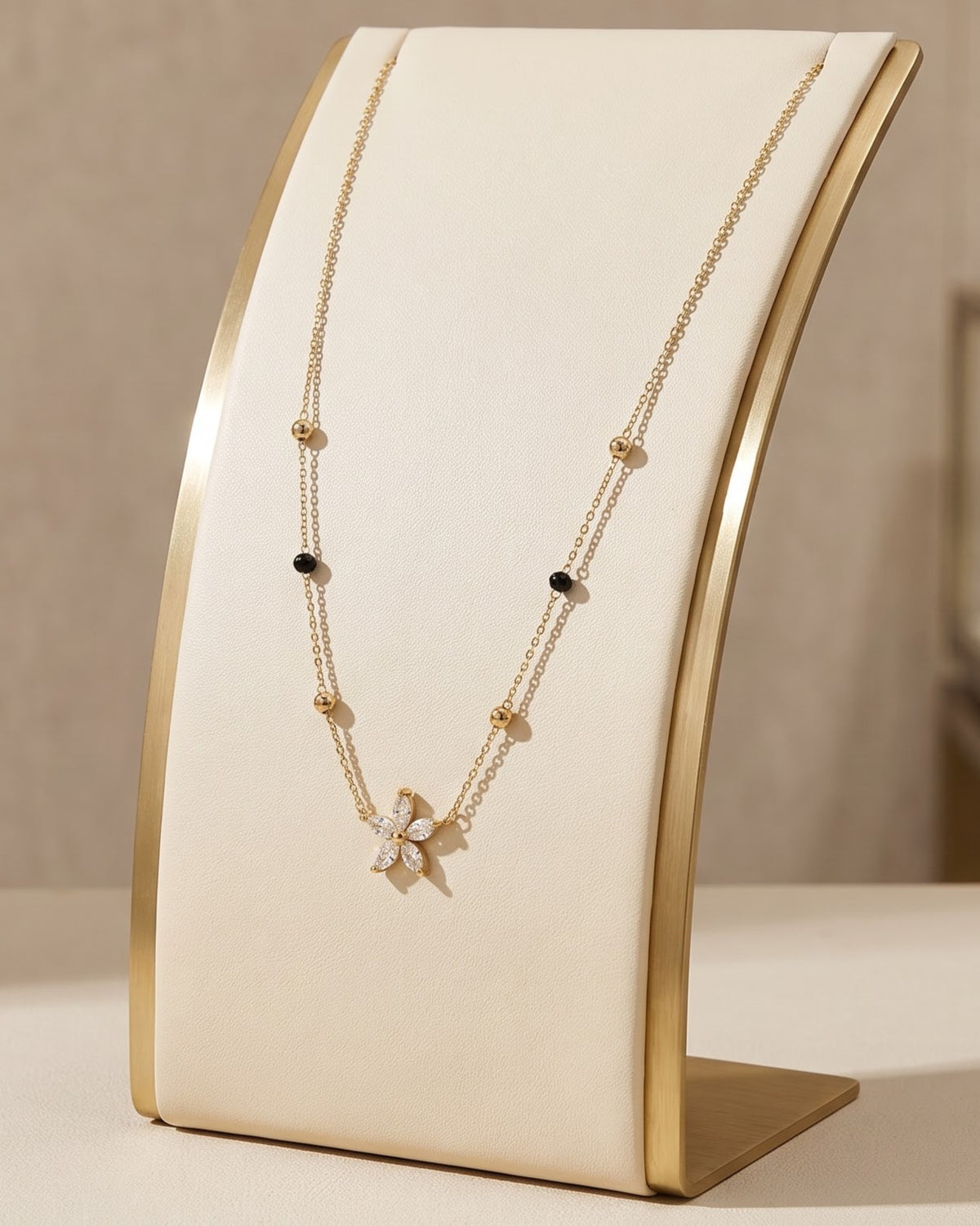 Solyssa Blossom Mangalsutra displayed on a jewelry stand showing chain length